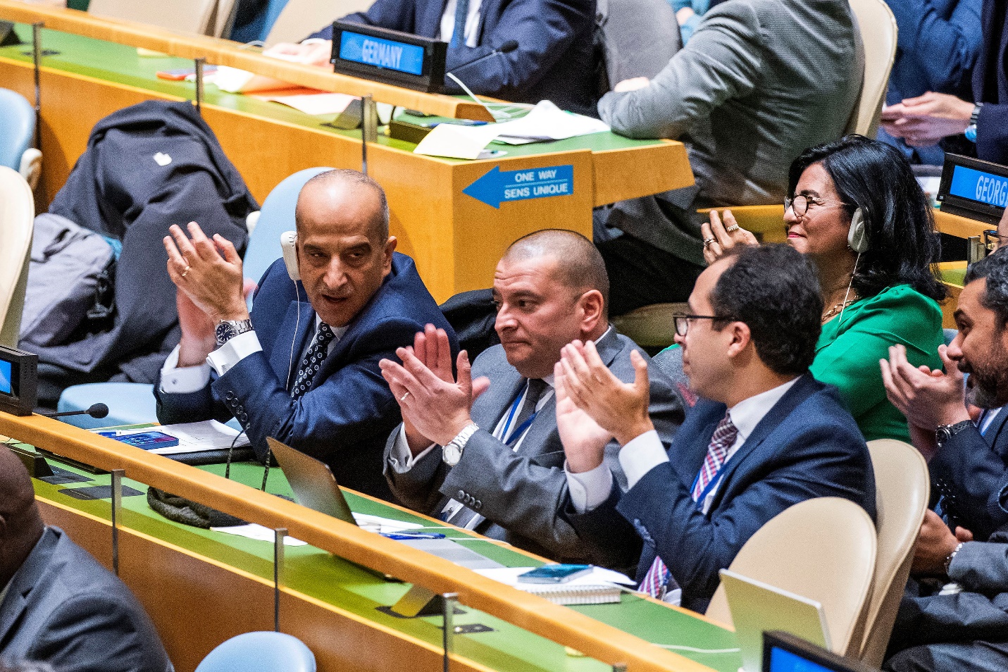 Delegates from Egypt applaud after looking at the voting results during the meeting of the UN General Assembly on ceasefire resolution, amid the ongoing conflict between Israel and Hamas, in New York City, U.S. on December 12, 2023. [Reuters/Eduardo Munoz]