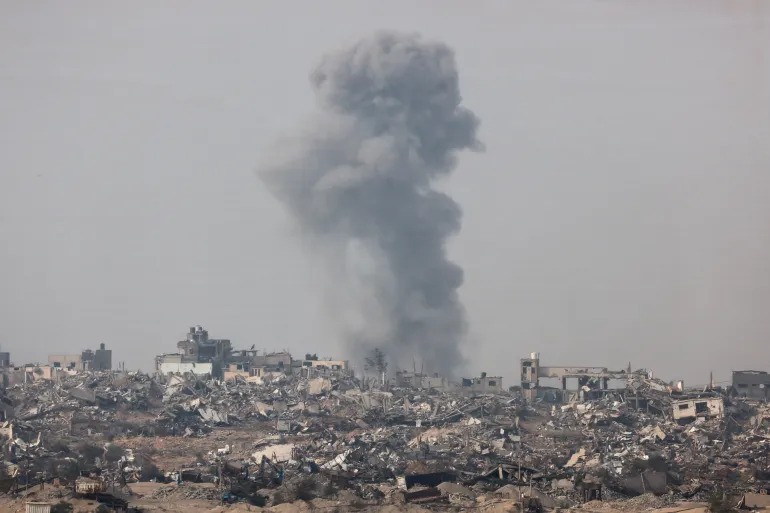 Smoke rises over Gaza, as seen from southern Israel, December 27 [Amir Cohen/Reuters]