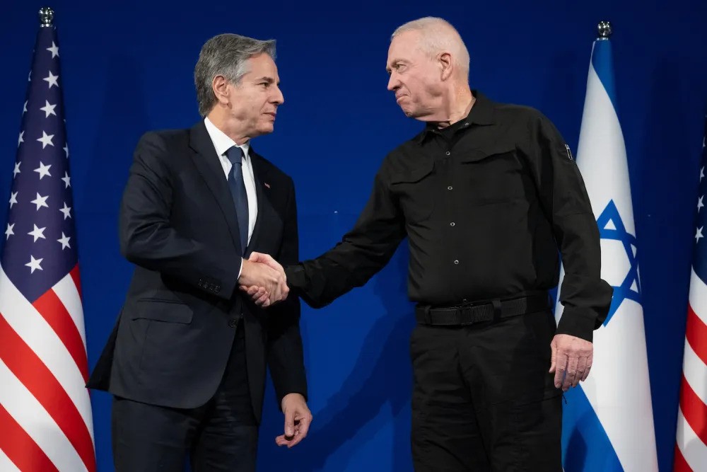 Israeli Defense Minister Yoav Gallant (right) and U.S. Secretary of State Antony Blinken shake hands prior to meeting in Tel Aviv, Israel, on November 30, 2023 [AFP/Saul Loeb]